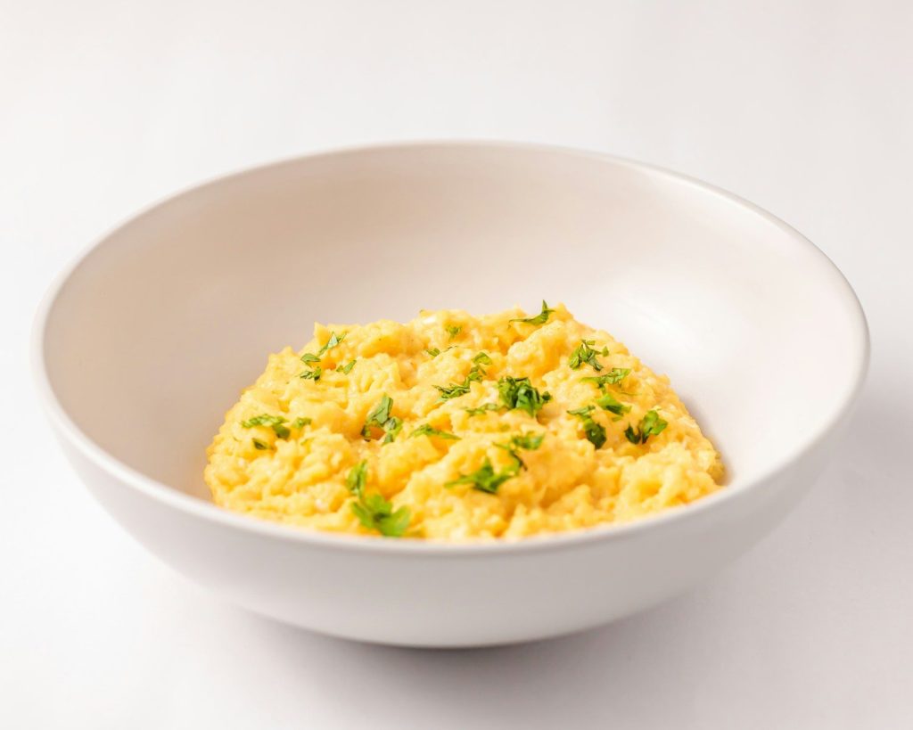 a close up of a bowl of food on a table