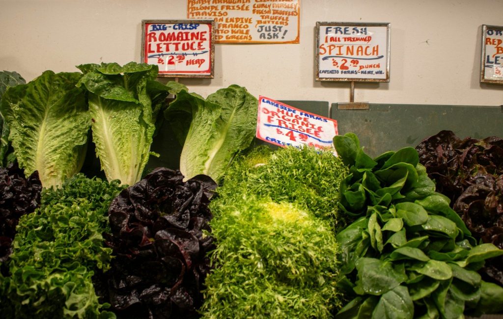 Fresh and colorful greens and lettuce for sale.