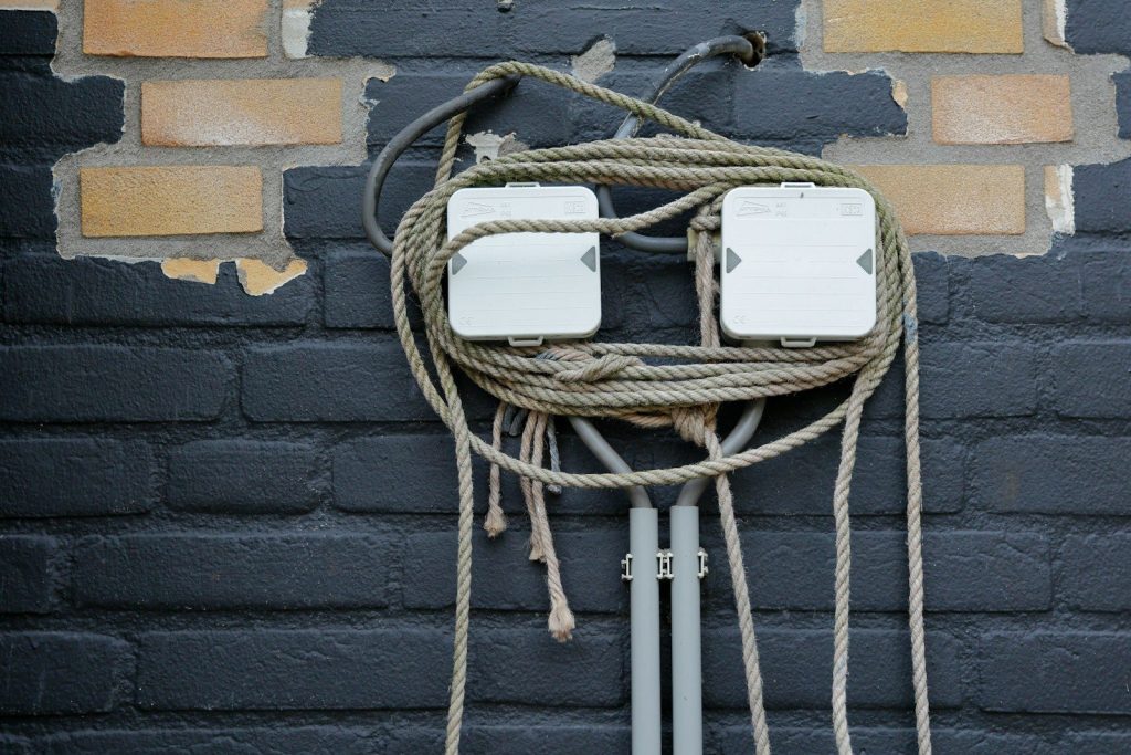 a couple of wires that are attached to a wall