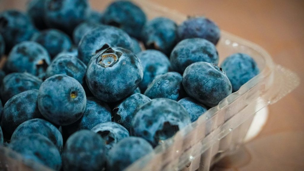 blue berries on brown wooden box