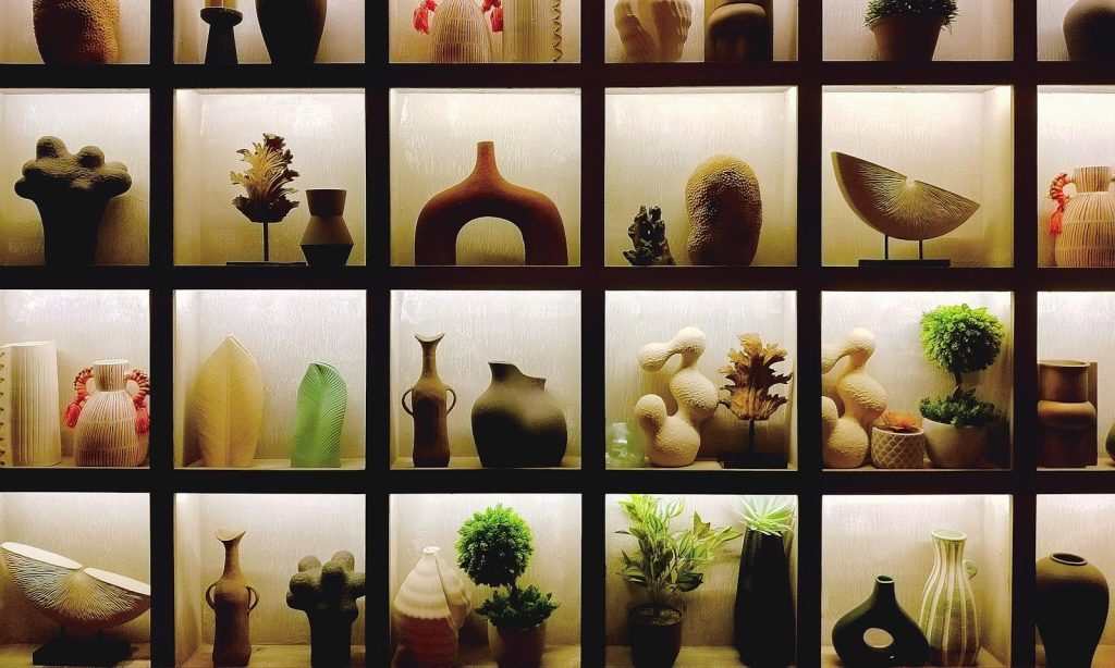 Various decorative objects displayed in illuminated cubbies