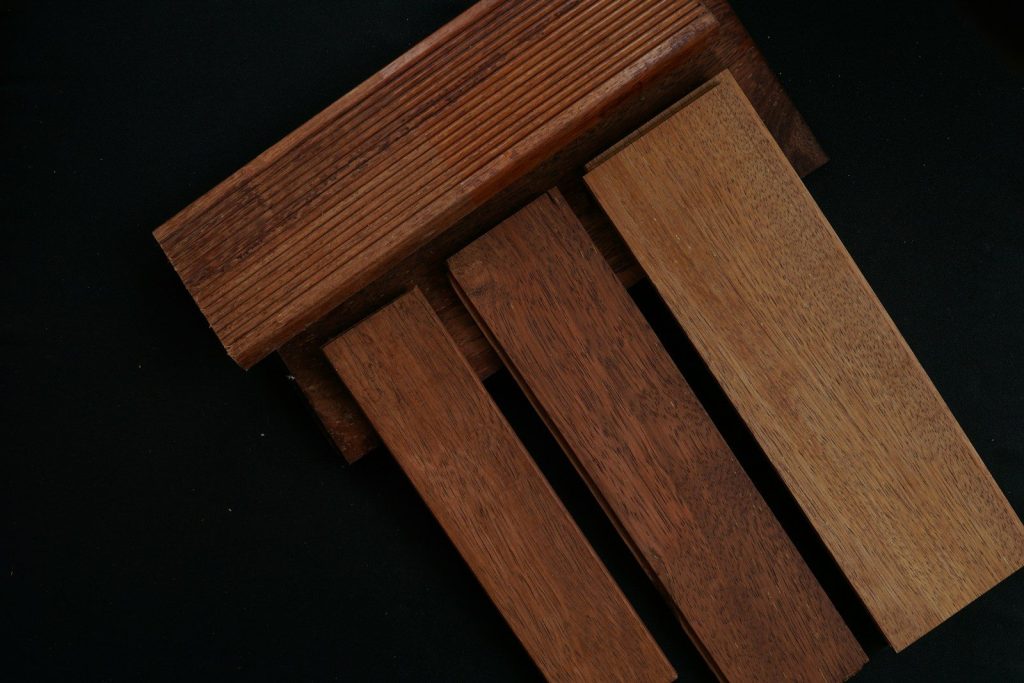 three pieces of wood sitting on top of each other
