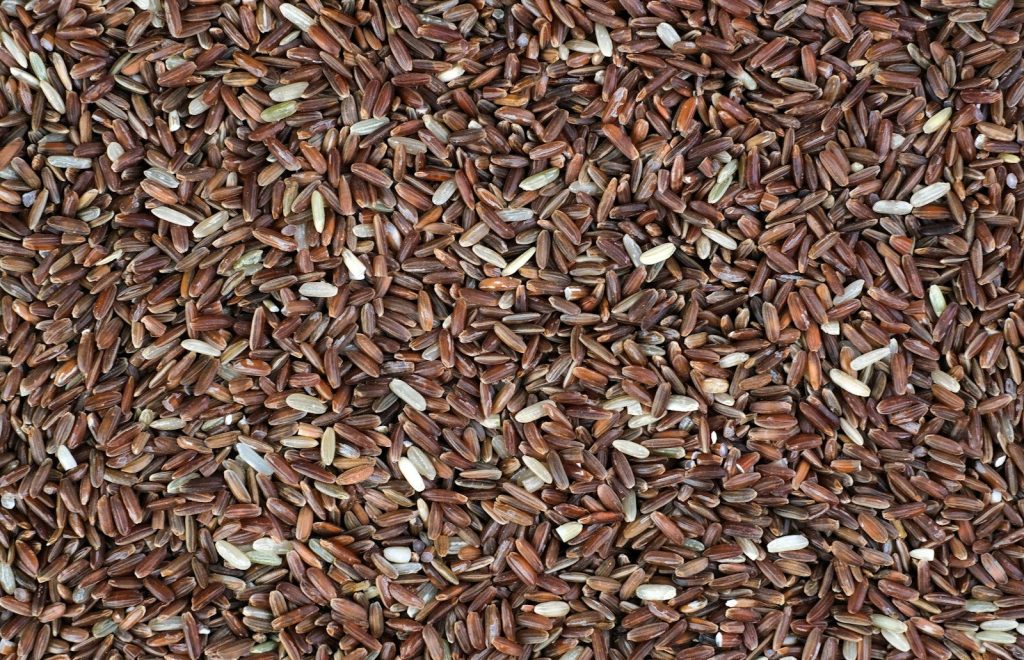 a close up of a pile of brown rice