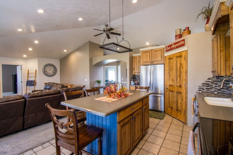 Bright modern kitchen interior featuring cozy dining and living space with rustic elements.