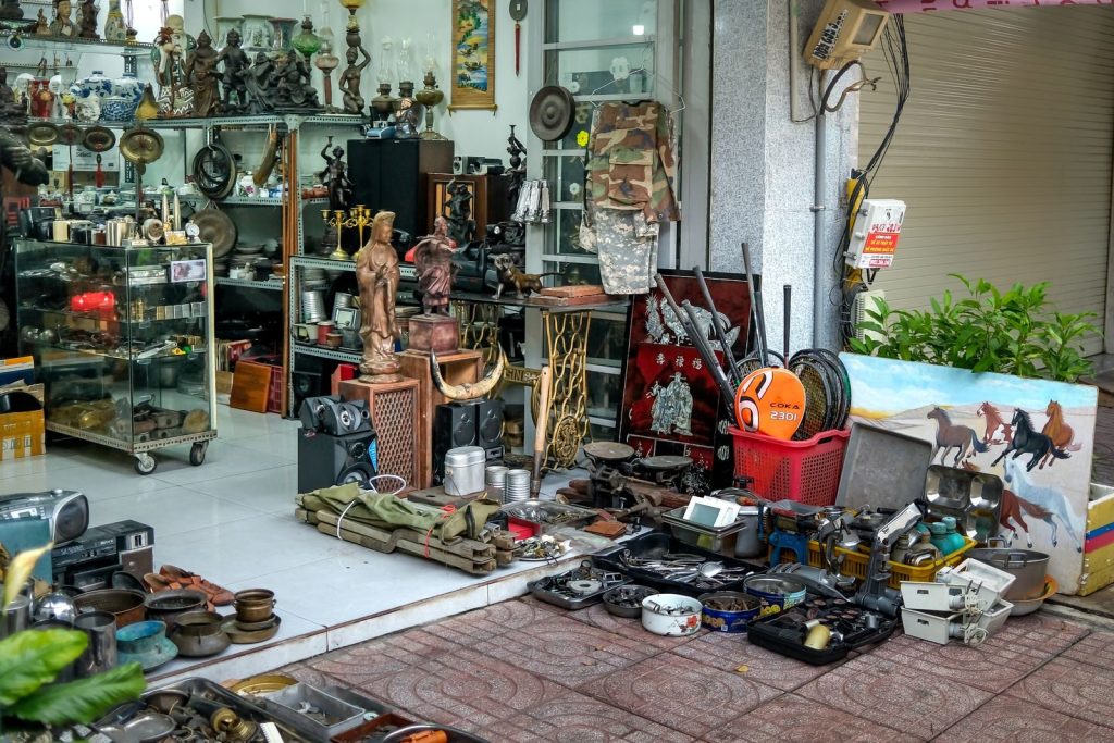 Explore a diverse range of antiques and collectibles displayed in a bustling retail store.