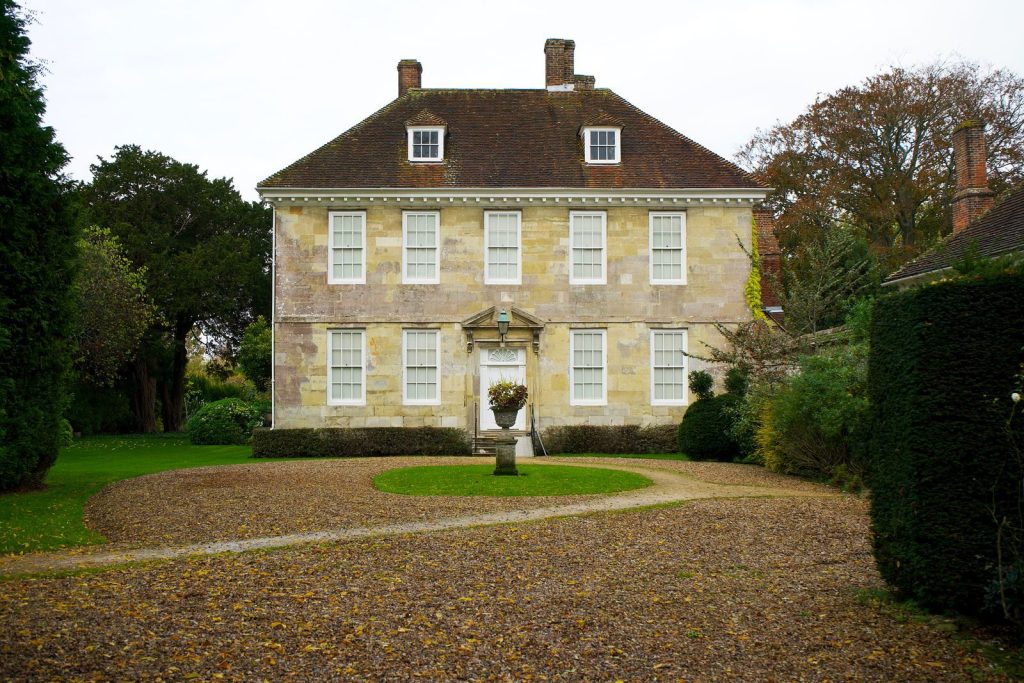 Classic English manor surrounded by lush gardens in Salisbury, UK.