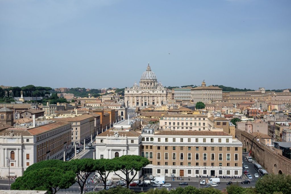Explore Rome's historic cityscape with a view of St. Peter's Basilica from above.