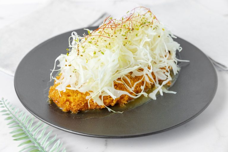 Savory Japanese tonkatsu served with fresh shredded cabbage.