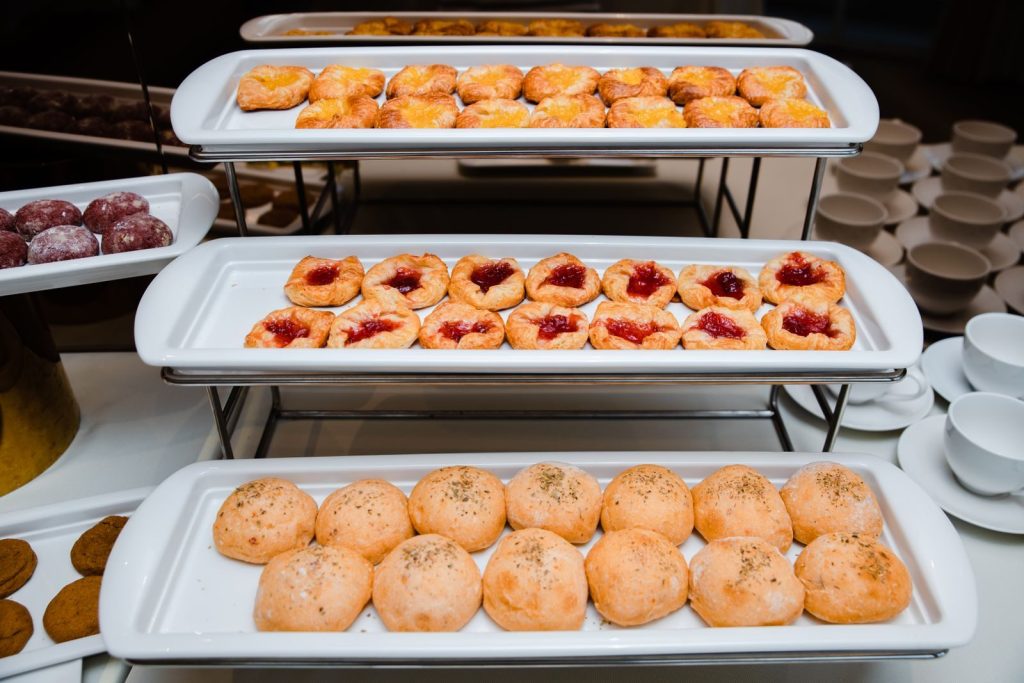 Delicious selection of pastries displayed at an indoor buffet event.