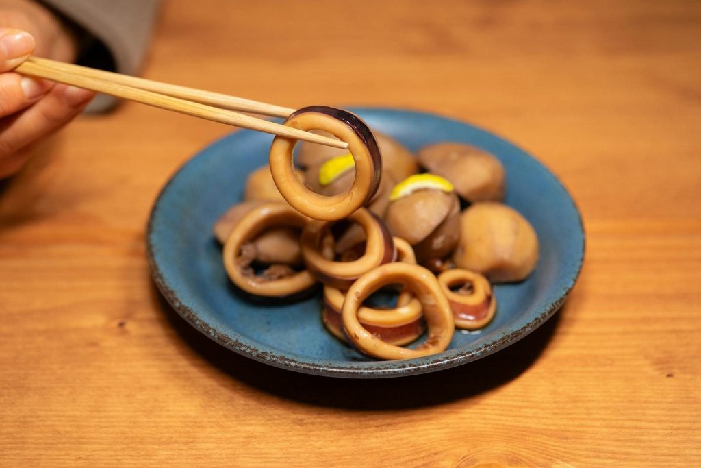 A flavorful plate of squids and potatoes, showcasing vibrant Asian cuisine.