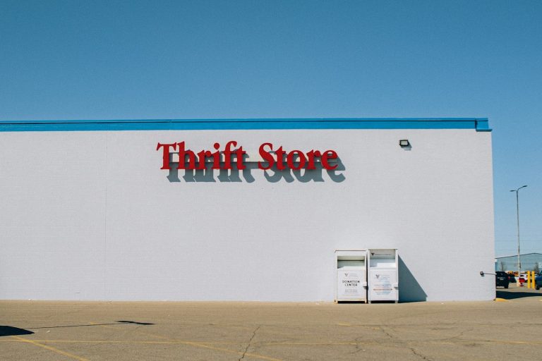 a thrift store sign on the side of a building
