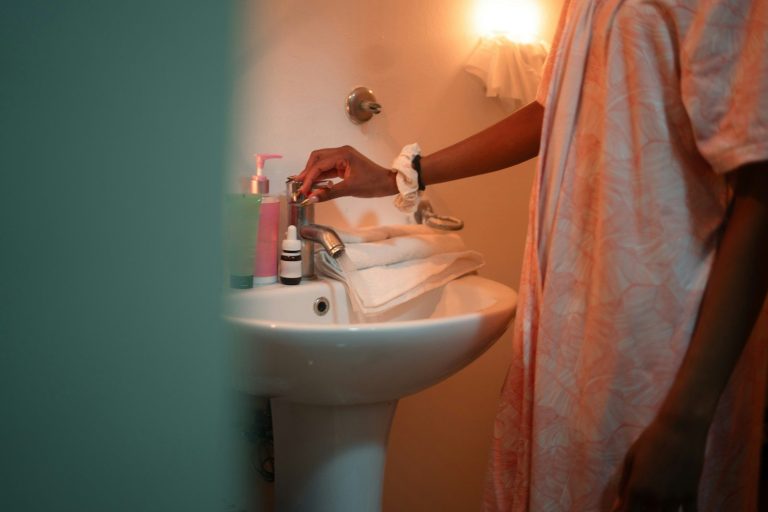 Person washing hands at a sink