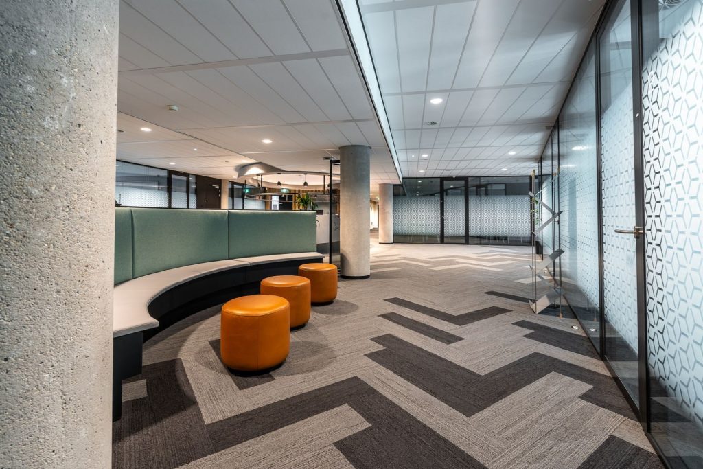 Spacious airport interior featuring modern design, comfortable seating, and ample walking space.