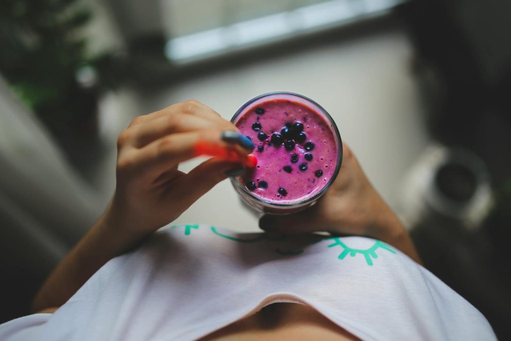 Enjoy a healthy and vibrant blueberry yogurt smoothie with a pop of color, perfect for a nutritious lifestyle.