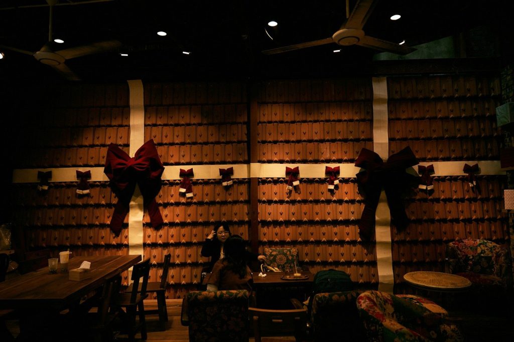 Restaurant interior decorated for holidays with large red bows