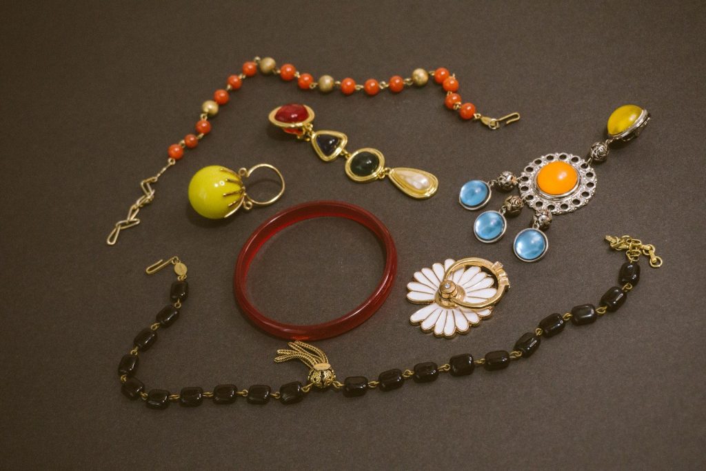 a bunch of jewelry that is laying on a table