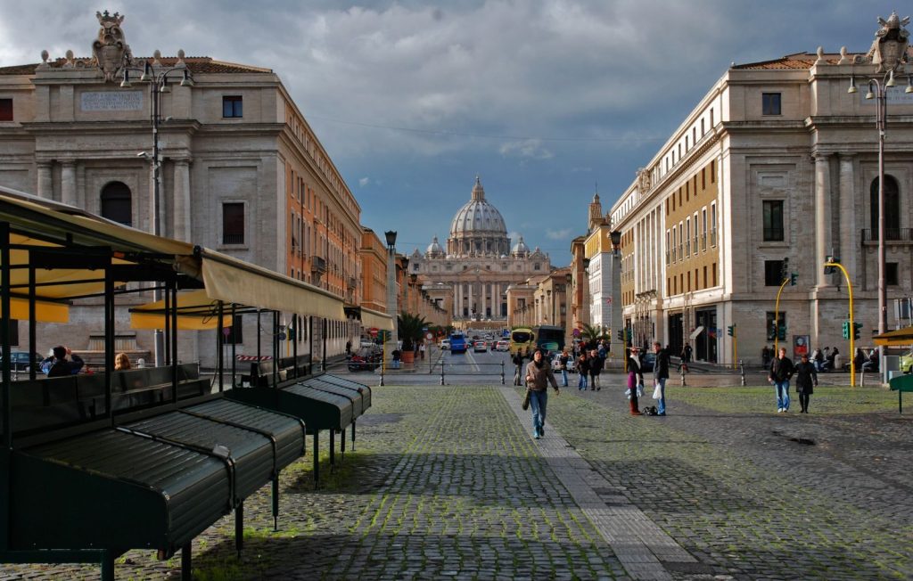 Majestic view of St. Peter's Basilica from Via della Conciliazione, Rome, Italy.
