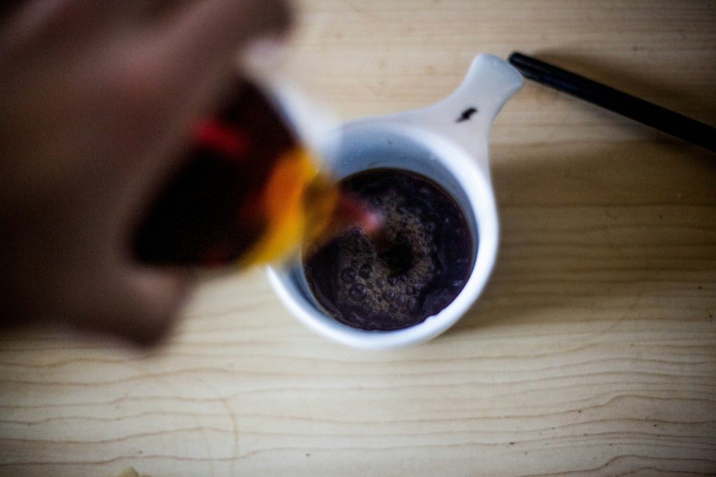 white ceramic mug with black liquid