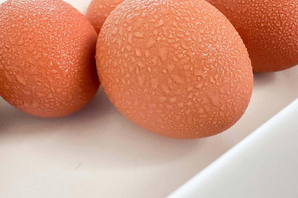 A group of oranges sitting on top of a white counter