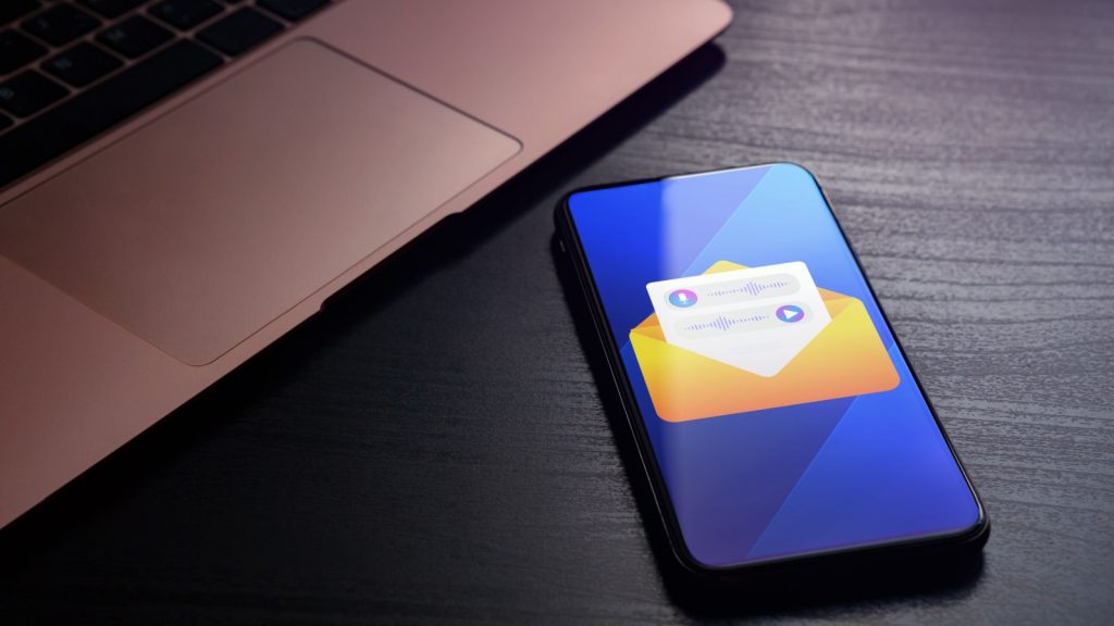 Voicemail concept. Push Notification with voice email message. Mail envelope, microphone and digital recording application on the smartphone display