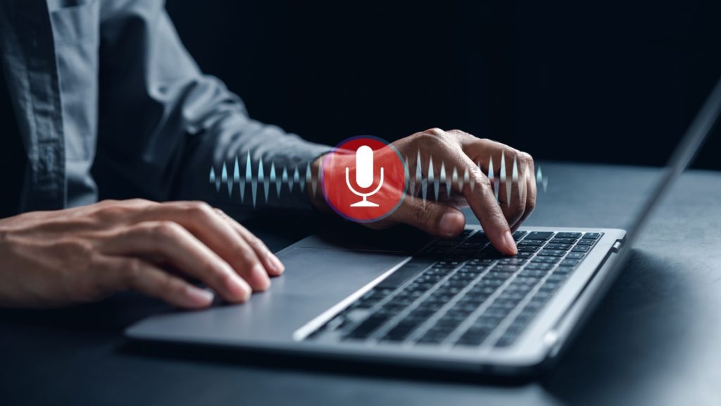 Businessman voice recording the conversation via computer with customers, telemarketing, consulting, voice assistance access to information and applications, write a message and send a message.