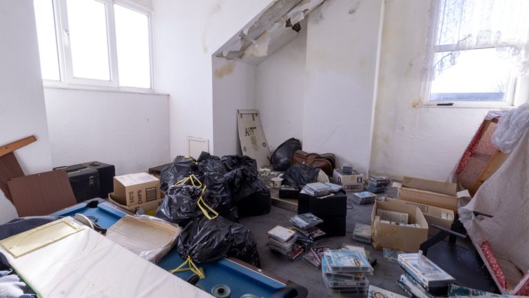 Leeds UK, 25th Feb 2022: Photo of an extremely rundown property with rubbish left everywhere and in need of repairs
