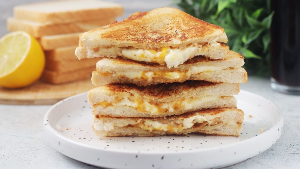 Grilled cheese sandwiches served for eating