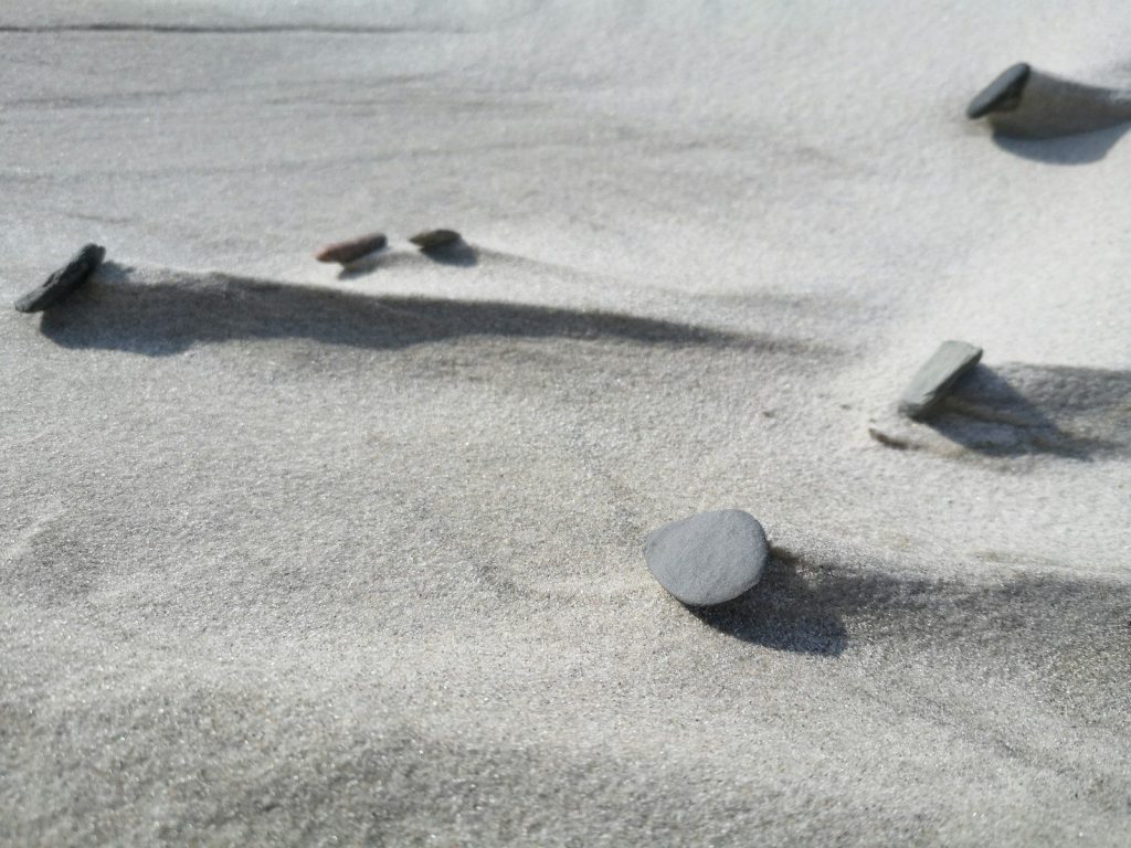 gray stone on gray sand