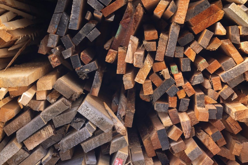 Pile of rough cut lumber and wood pieces.