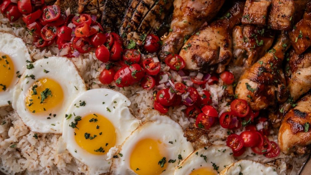 Chicken, eggs, and rice: a delicious food platter.