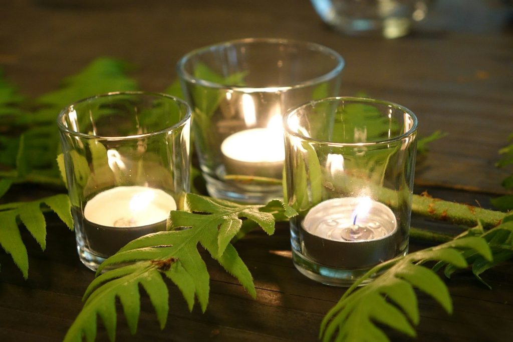 A couple of candles sitting on top of a table