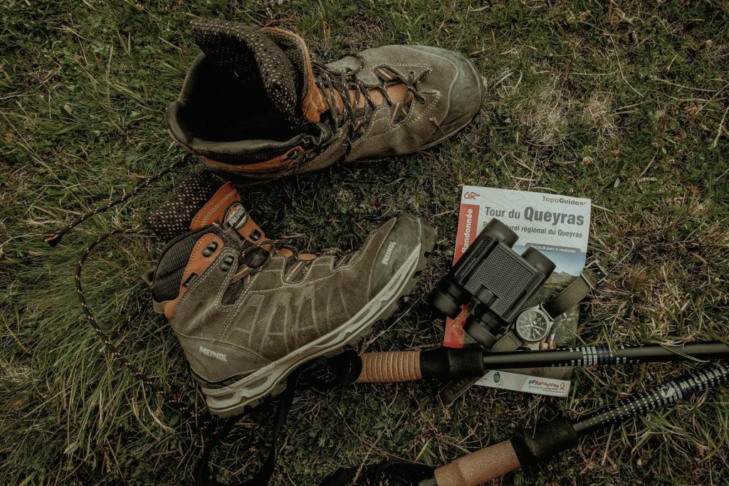 a pair of boots and a gun on the ground