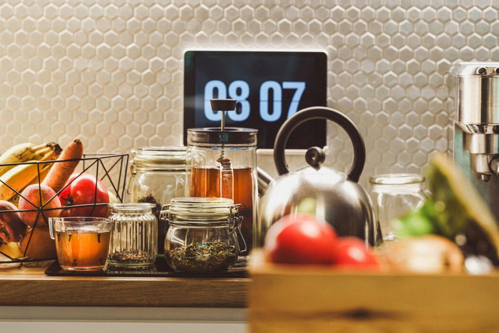 A kitchen counter topped with lots of food