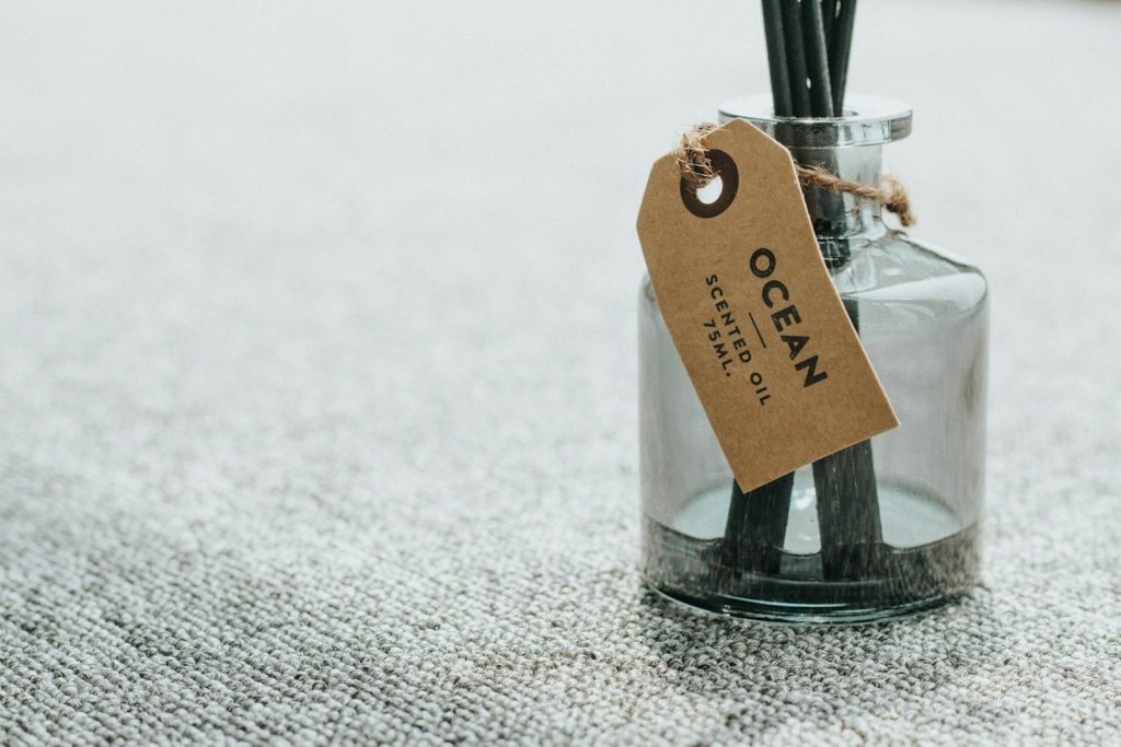 brown paper bag on gray textile