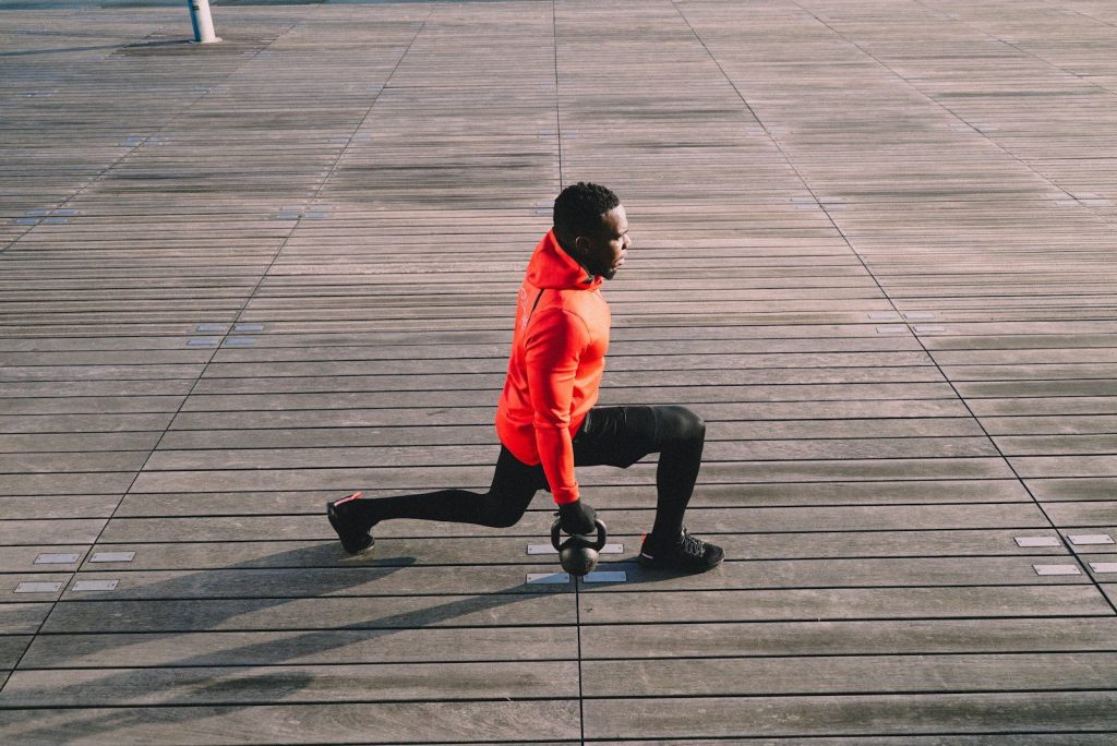 A man riding a skateboard down a sidewalk