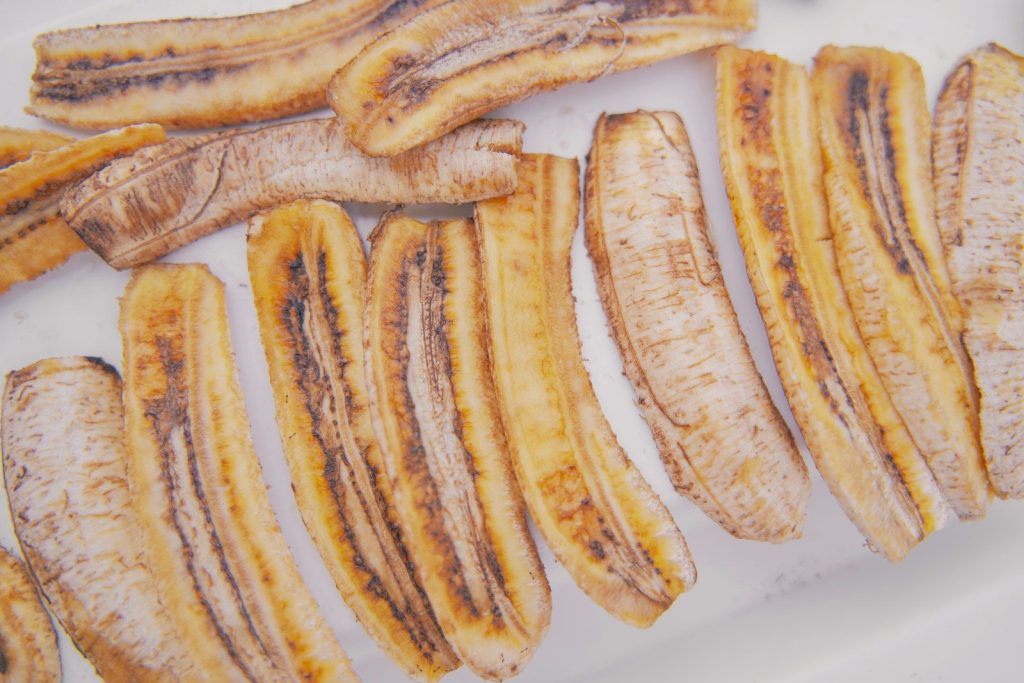 Dried banana slices arranged in rows
