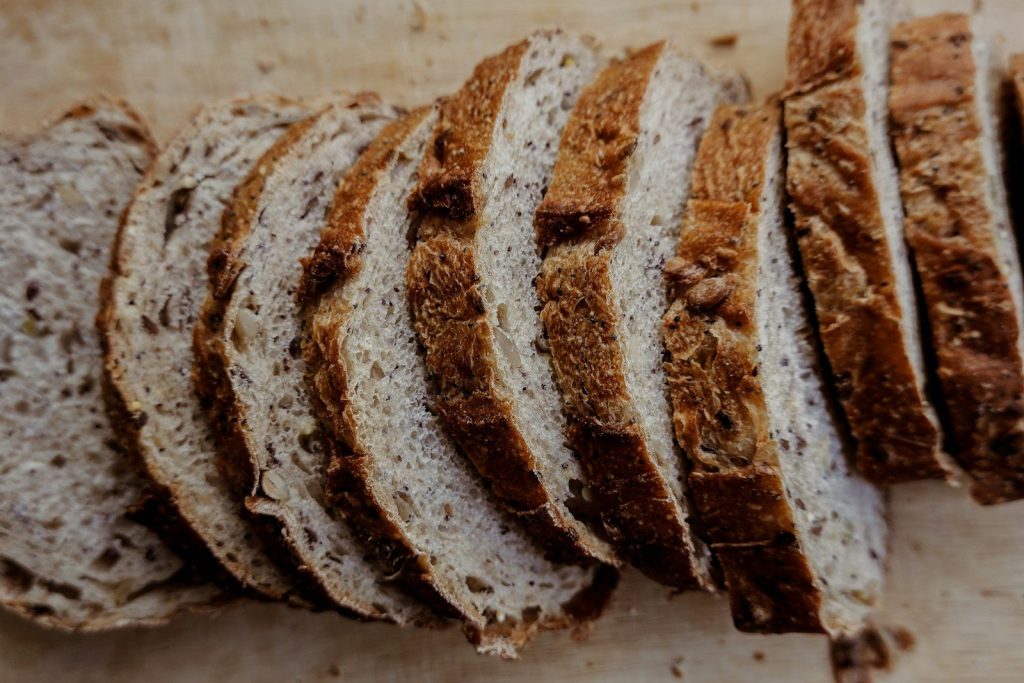 a close up of sliced bread on a cutting board