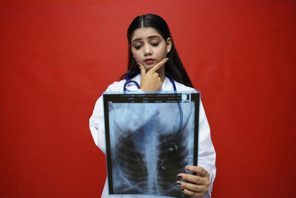 a woman with her hand on her chin