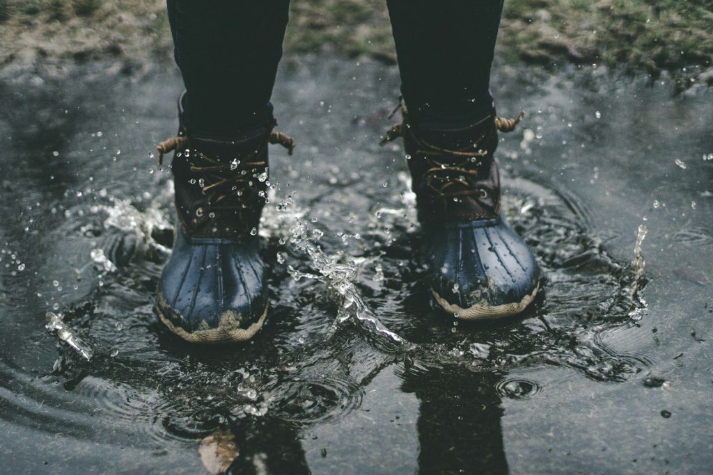 person standing on splashed water