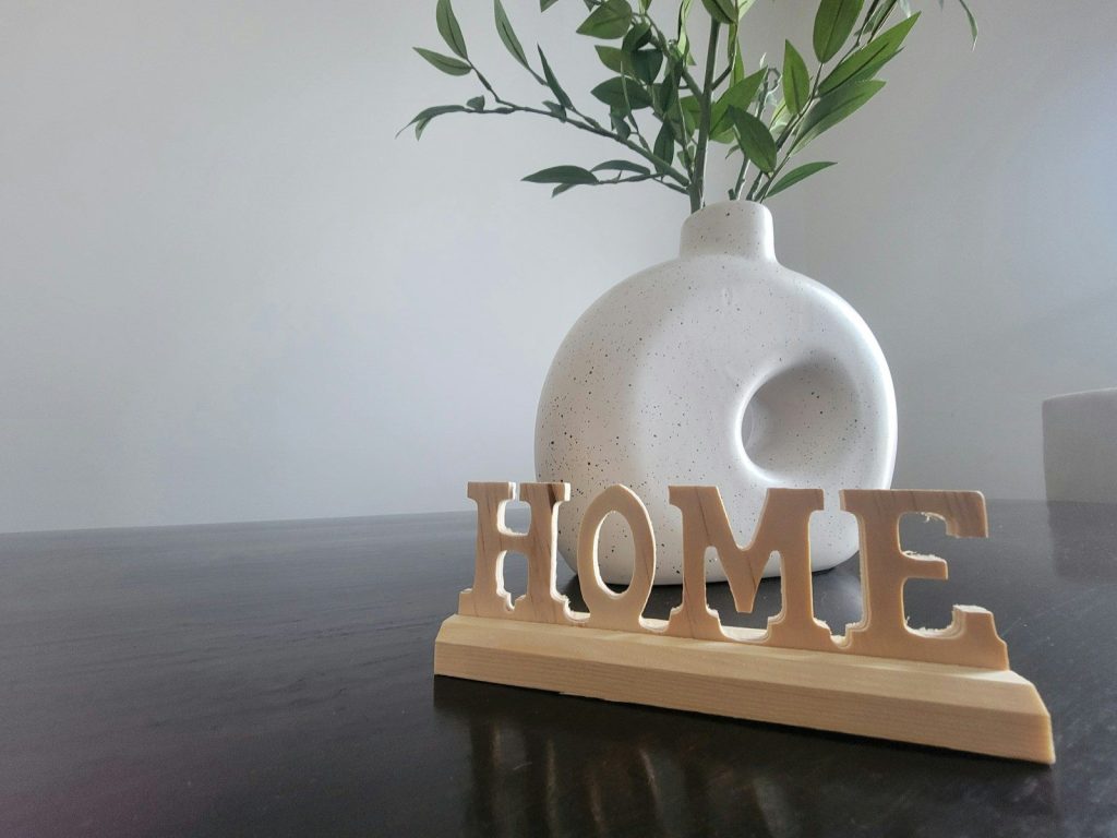 a vase with a plant in it sitting on a table