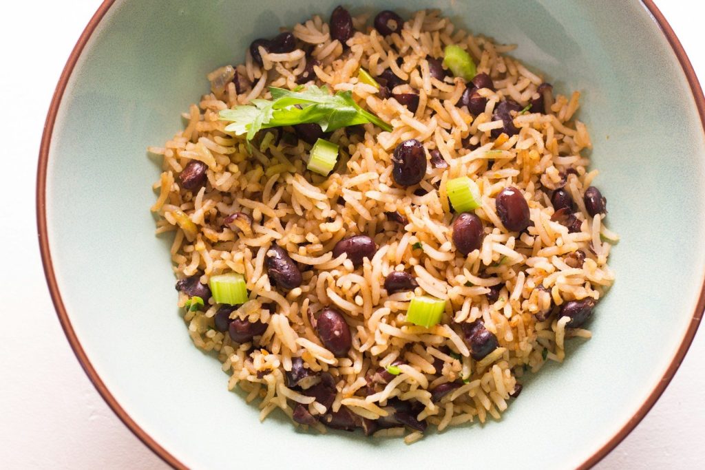 brown and green food on white ceramic bowl
