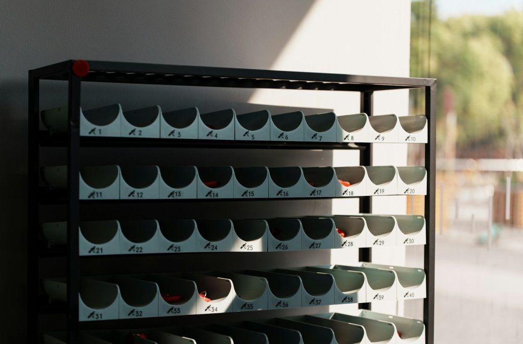 Black metal shelving unit with many compartments