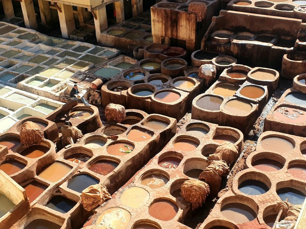 a pile of clay pots sitting next to each other