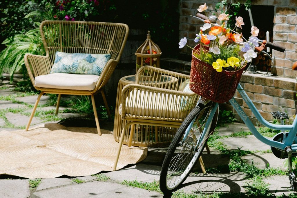 A blue bicycle with a basket full of flowers