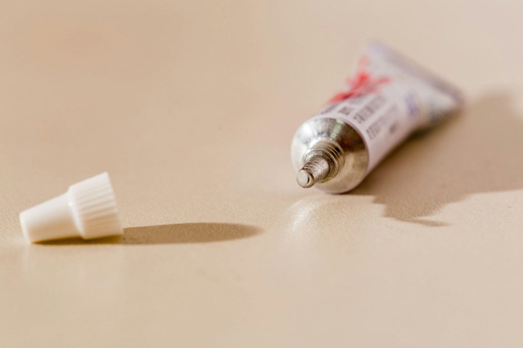 white tube bottle on white table