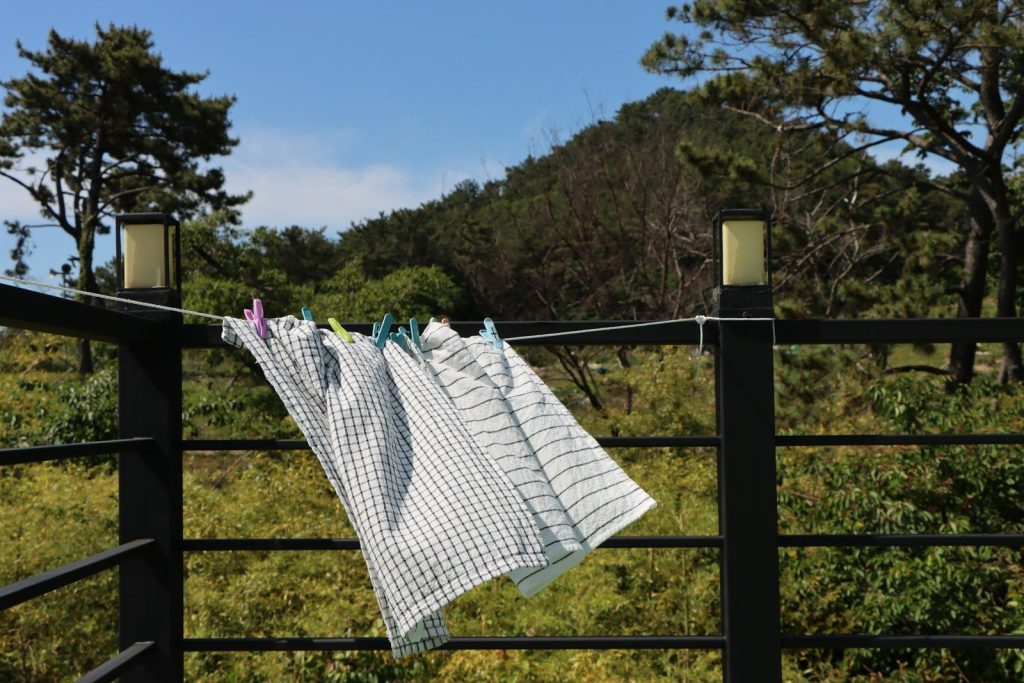 clothes hanging on a clothes line in a field