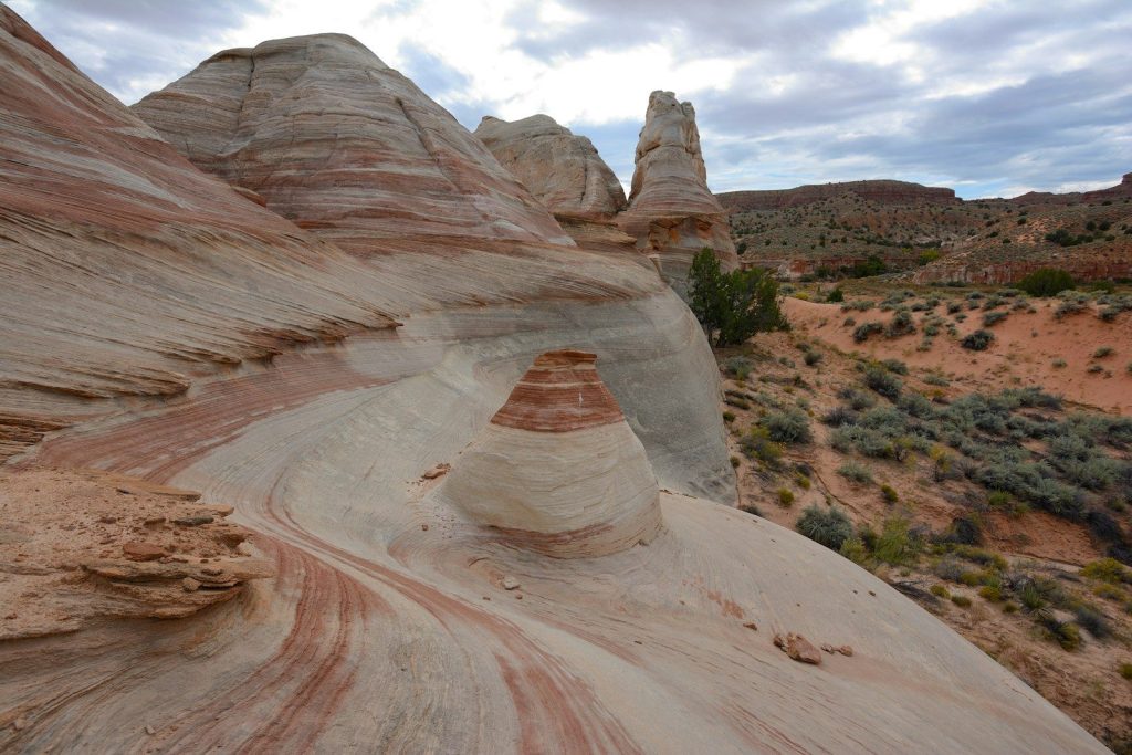 a large rock formation in the middle of a desert