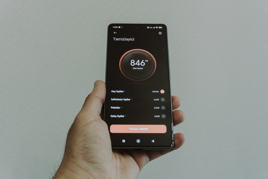 Hand holding smartphone displaying a health application