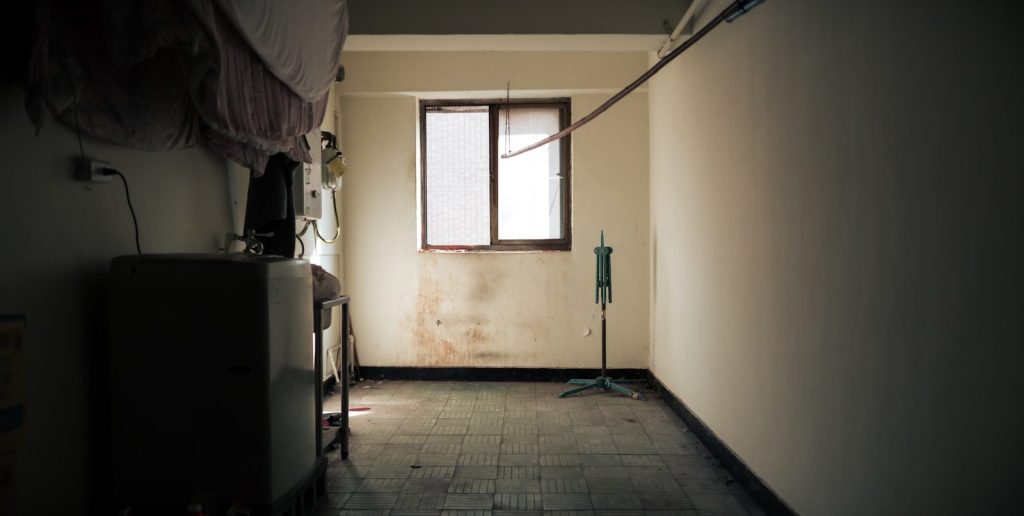 Empty room with a window and old furniture