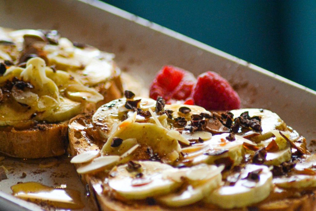 A close up of a piece of bread with fruit on it